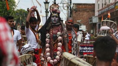 Hindu devotees take part in a procession dedicated to the Hindu god Lord Shiva, that marks the first Monday of the monsoon (Sawan) month, in Varanasi, India. AFP