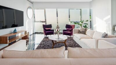 The light pours in from the floor to ceiling windows.