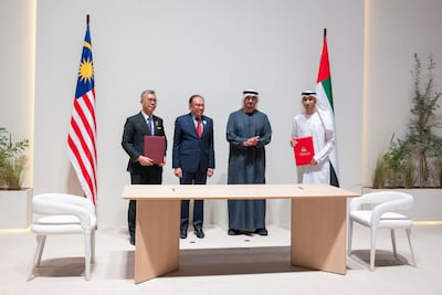 President Sheikh Mohamed along with Anwar bin Ibrahim, Prime Minister of Malaysia during the signing of the UAE-Malaysia Comprehensive Economic Partnership Agreement. Abdulla Al Bedwawi / UAE Presidential Court