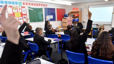 Pupils raise their hands in a lesson as they return to school at Copley Academy on September 09, 2021 in Stalybridge, England. Getty