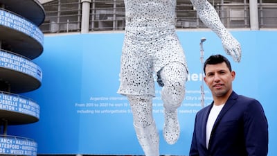Manchester City club legend Sergio Aguero attends the unveiling of his statue outside the Etihad Stadium, to commemorate the 10th anniversary of the club's first Premier League title and the iconic '93:20' moment in Manchester, England, Friday May 13, 2022. AP