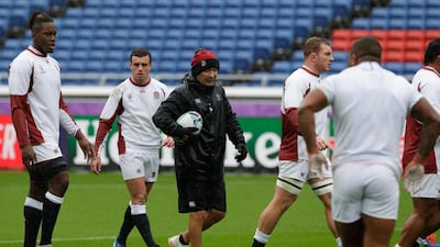 England coach Eddie Jones, centre, gives instructions during training at the Yokohama International Stadium. AP