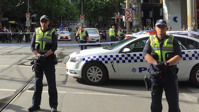 Policemen block members of the public from walking towards the Bourke Street mall. Reuters