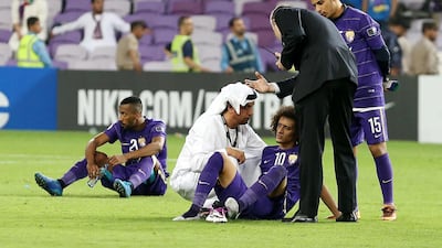 Omar Abdulrahman, No 10, is consoled after defeat in the Asian Champions League final. Pawan Singh / The National