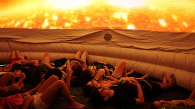 People lie down in a portable planetarium in Buitrago del Lozoya, Spain. Reuters