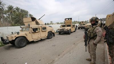 In this file photo taken before the attack, Iraqi forces patrol the town of Tarmiyah, near Balad Air Base. AFP
