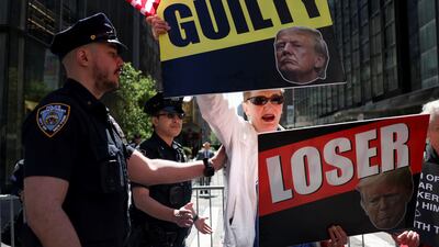 An anti-Trump protester outside Trump Tower, in New York, the day after a guilty verdict in the former US president's criminal trial. Reuters