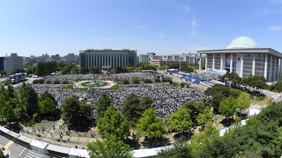 People attend the inauguration ceremony for South Korea's new President Yoon Suk Yeol at the National Assembly in Seoul. President Yoon Suk-yeol took the oath of office on Tuesday, vowing to rebuild the nation on the foundation of a liberal democracy and market economy. Getty Images