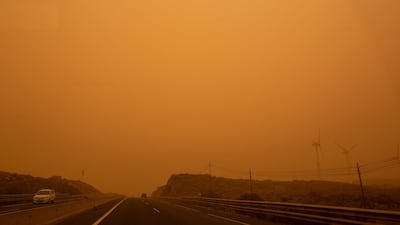 Cars drive on the TF-1 highway during a sandstorm in Santa Cruz de Tenerife, on the Canary Island of Tenerife. AFP