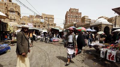 Yemenis walk through a market in the old quarter of Sana'a, Yemen. EPA