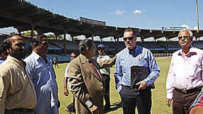 The England cricket team's security consultant Reg Dickason, second from right, examines facilities at Chennai as the BCCI secretary N Srinivasan, third from left wearing coat, looks on during a process to determine if it is safe for England to play two Test matches in India after last week's terrorist attacks in Mumbai.