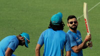 India's captain Virat Kohli, right, is wary of complacency. Bikas Das / AP Photo