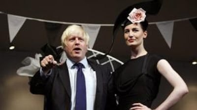 Mayor Boris Johnson officially opens London Fashion Week with the model Erin O'Connor on Friday.