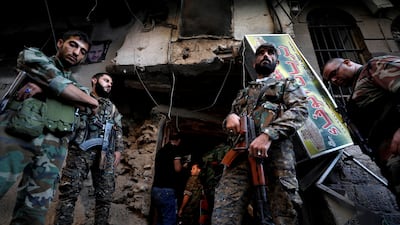 Syrian Army soldiers near the police headquarters in central Damascus, Syria. Reuters