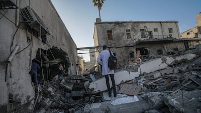 A Palestinian doctor at the site of the destroyed building of Al Ahli Baptist hospital following an Israeli air strike in Gaza City, 13 April 2025. EPA