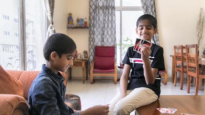Rishi, 9, and his brother Rohan, 6, had their hair shaved in aid of charity. Reem Mohammed / The National