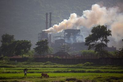 File photo: Smoke rises from a coal-powered steel plant at Hehal village near Ranchi, in India's eastern state of Jharkhand. AP