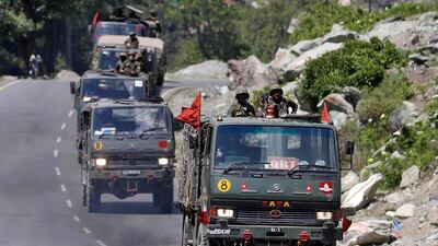 An Indian Army convoy moves along a highway leading to Ladakh at Gagangeer in Kashmir's Ganderbal district June 18, 2020. Reuters