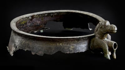 A bronze spout. First century AD Metal bowls with animal-shaped spouts attached to their rims were characteristic of eastern Arabia at around the start of the Christian era.