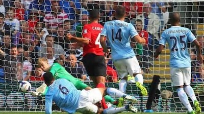 Manchester City coach Manuel Pellegrini has already had to defend goalkeeper Joe Hart, left, for his lapses in two games, against Scotland and the English Premier League match against Cardiff City. Geoff Caddick / EPA