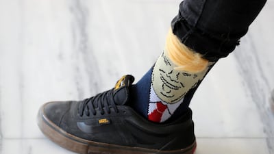 A supporter wears a Trump sock.