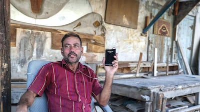 Mohammed Fazlu outside his house. Victor Besa / The National