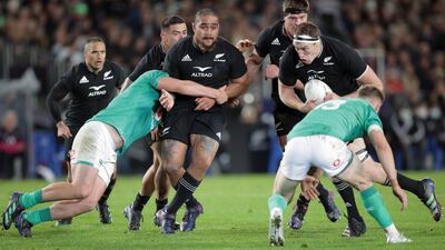 Ofa Tu'ungafasi (L) and Brodie Retallick of New Zealand charge forward. Getty