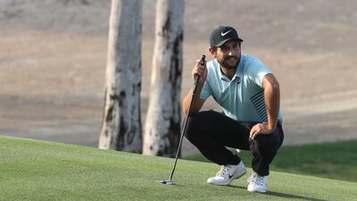 Alexander Levy of France eyes the ball during day three of the Omega Dubai Desert Classic at Emirates Golf Club. Karim Sahib / AFP