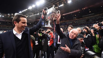 Rennes owner Francois Pinault, right celebrates with manager Julien Stephan after Rennes won the French Cup. Anne-Christine Poujoulat / AFP