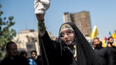 An Iranian woman shows a V-sign during a protest marking Jerusalem Day on the last Friday of the holy month of Ramadan in Tehran, Iran on June 8, 2018. Reuters