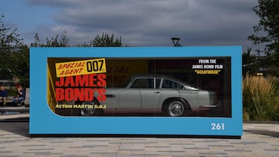 A life-size Corgi Toys model of James Bond's Aston Martin DB5 from 'Goldfinger' on display outside Battersea Power Station in London. Photo: Alamy