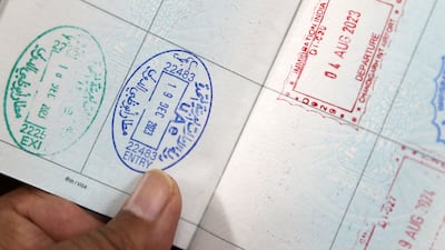 Immigration stamps on a passport in Dubai. Pawan Singh / The National