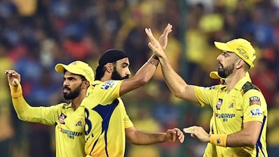 Chennai players celebrate after the dismissal of Bengaluru's Virat Kohli, caught by Daryl Mitchell off the bowling of Mitchell Santer. AFP