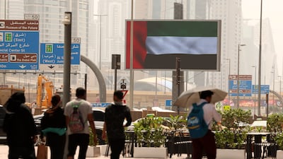 The UAE flag on display in Dubai where a powerful sense of shared purpose permeates public life. Chris Whiteoak / The National