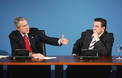 German chancellor Gerhard Schroeder, right, won re-election after opposing George W Bush's invasion in Iraq. Getty Images