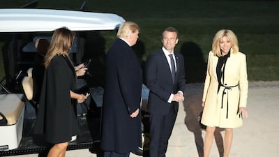 US President Donald Trump and First Lady Melania Trump stand with French President Emmanuel Macron and his wife, Brigitte Macron following a dinner at Mount Vernon, the estate of the first US President George Washington, in Mount Vernon, Virginia, April 23, 2018. Ludovic Marin / AFP