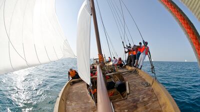 Volvo Ocean Race crew members compete in the Abu Dhabi Sailing Festival Race in 60ft Dhow boats, during the Volvo Ocean Race 2011-12 in Abu Dhabi. (Marc Bow/Volvo Ocean Race)