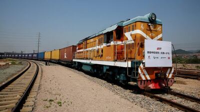 A train carrying containers from London arrives at the freight railway station in Yiwu, Zhejiang province, China, April 29, 2017. The sign at the front of the train reads: "First Sino-Euro Freight Train (London Yiwu). REUTERS/Thomas Peter