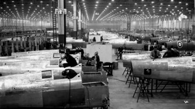 Workers in the assembly area of an aircraft factory in the Midlands, building Spitfires in 1941. Getty Images