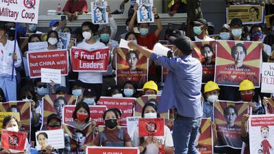 A protester holds a placard calling for the release of detained Myanmar State Counselor Aung San Suu Kyi during a protest against the military coup outside the Chinese Embassy in Yangon. EPA