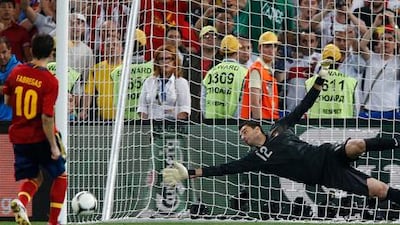 Cesc Fabregas scores from the penalty spot to put Spain into the Euro 2012 final