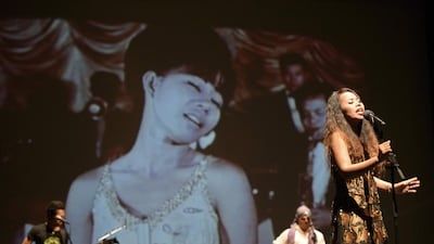 The Cambodian Space Project performing live against a projected backdrop of images from the lost pre-Khmer Rouge years of Cambodian music. Courtesy Michael Laub / The Cambodian Space Project