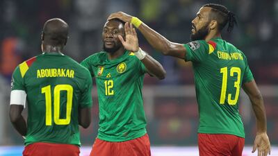 Cameroon forward Karl Toko Ekambi celebrates with Vincent Aboubakar and Eric Choupo Moting after scoring his team's first goal. AFP