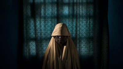 Adam Ferguson took first place in the 'People - Stories' category. This picture from the story shows Aisha, age 14, standing for a portrait in Maiduguri, Borno State, Nigeria. She was kidnapped by Boko Haram then assigned a suicide bombing mission. After she was strapped with explosives, she found help instead of blowing herself and others up. EPA/ADAM FERGUSON/NEW YORK TIMES