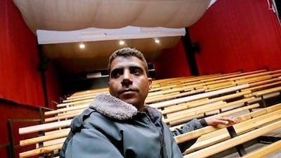 Former Palestinian militant Zakariya Zubeidi, 31, poses at the building of the newly formed Freedom Theatre in the West Bank refugee camp of Jenin in January 2008.