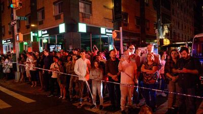 Onlookers stand behind a police cordon near the site of the explosion. Rashid Umar Abbasi / Reuters