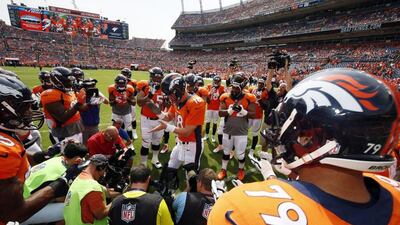 Denver Broncos quarterback Peyton Manning rallies the team before their NFL game against the Baltimore Ravens last week. Jack Dempsey / AP / September 13, 2015