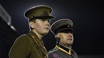 Officers wearing replica World War I British and German army uniforms watch Wednesday's football match between the British and German armies in Aldershot to commemorate the 100th anniversary of the match played during the Christmas Day Truce in 1914 during World War I. Toby Melville / Reuters