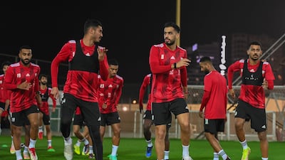 Khalil Ibrahim, left, and Majed Hassan, right, warm up for the training session. Photo: UAE FA