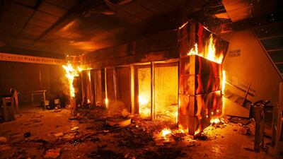 A subway ticket office is seen on fire during a protest against the increase in the subway ticket prices in Santiago, Chile. Reuters